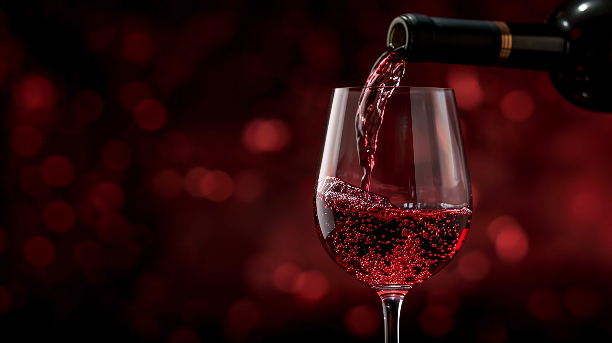 Red wine poured out of a glass