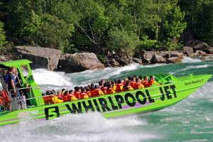 Niagara Falls jet boat tour in Devil’s Hole rapids with passengers getting soaked