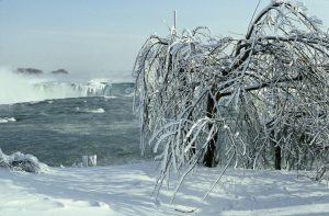 Ice formation at Niagara Falls in winter with frozen trees