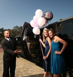 Group of friends arriving in a limousine for a Niagara Falls celebration tour